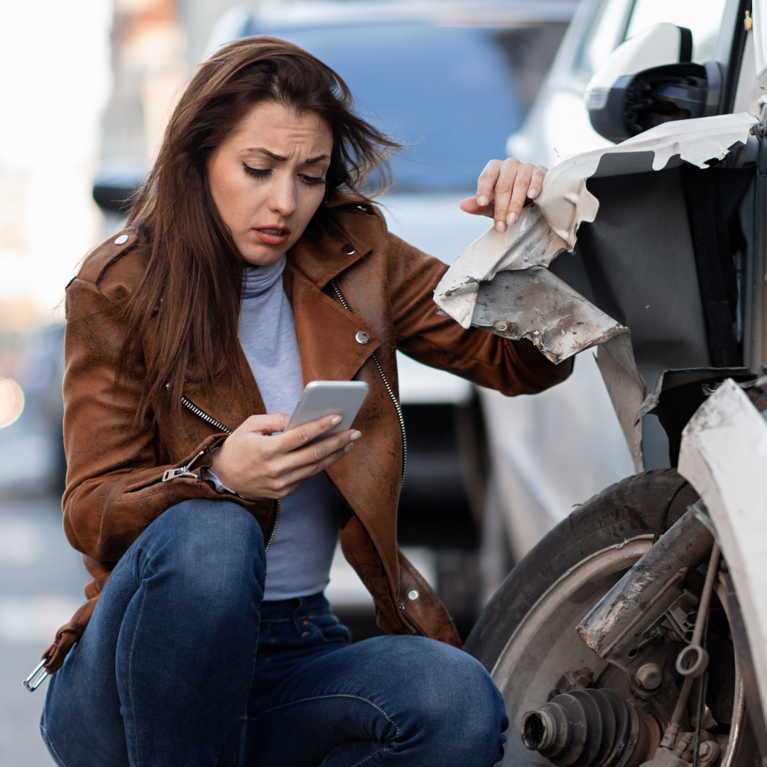woman looking worried after getting off the phone with insurance