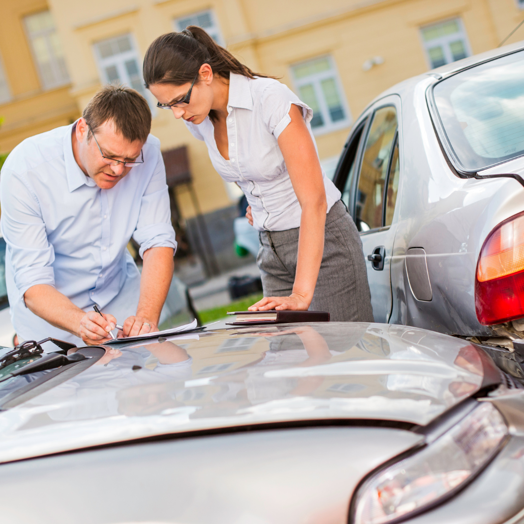 drivers swapping information after car accident