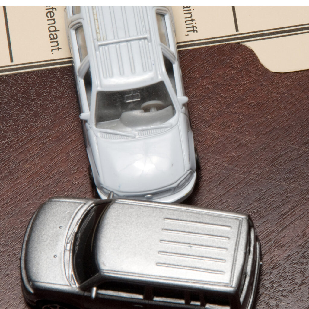 two toy cars simulating an accident