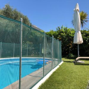 A pool with a fence around it.