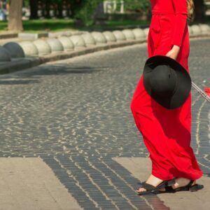 A woman wearing bright red clothing.