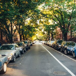 A street lined with cars.