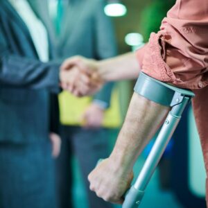 injured client shaking hand