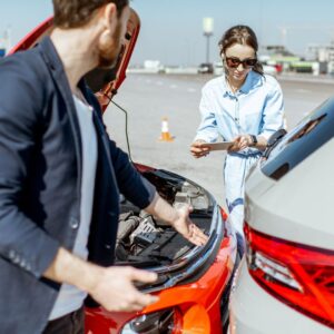 Woman quickly taking notes after an auto accident