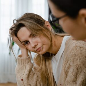 stressed new mother speaking with lawyer