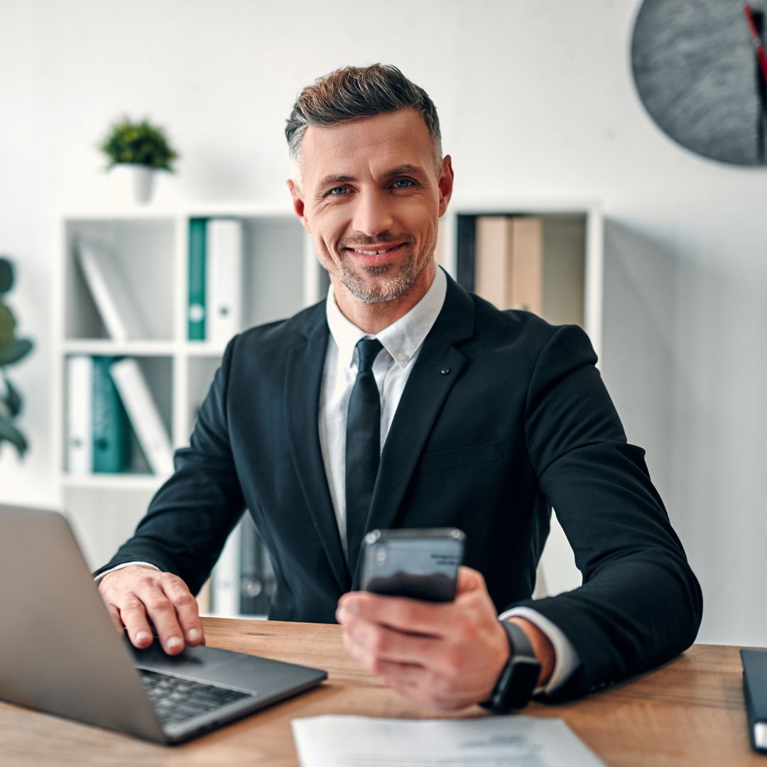 business man on phone and laptop