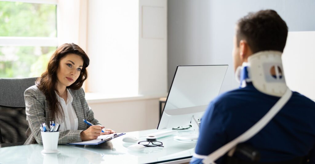 injured client speaking with lawyer