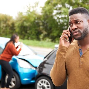 man on phone after being involved in a car collision