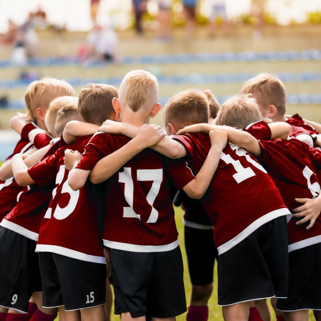 photo of kids soccer huddle