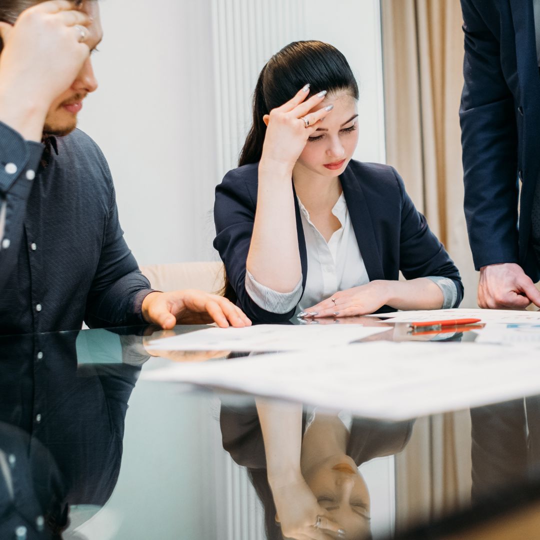 Two people look at a complex claim