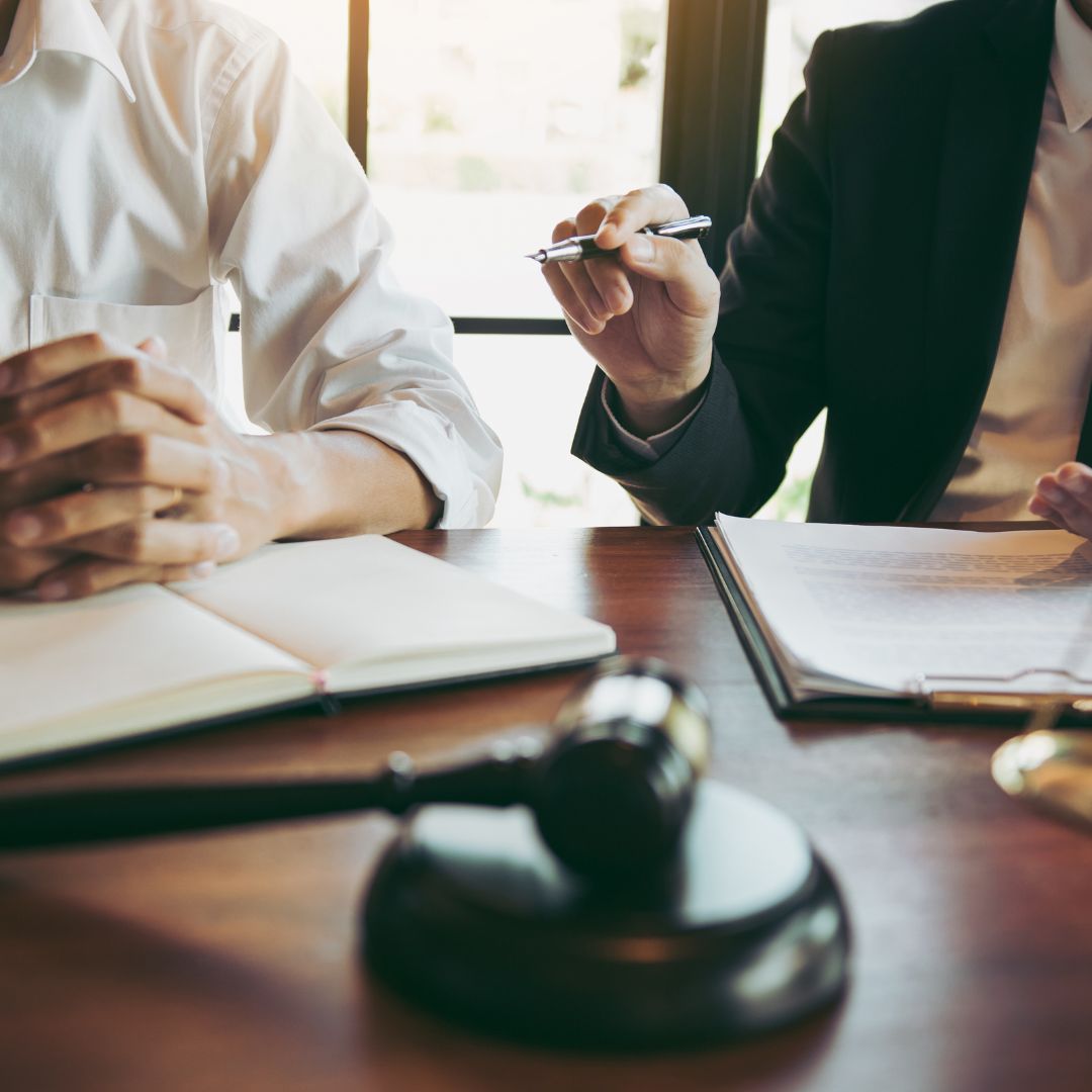 A lawyer meets with a client