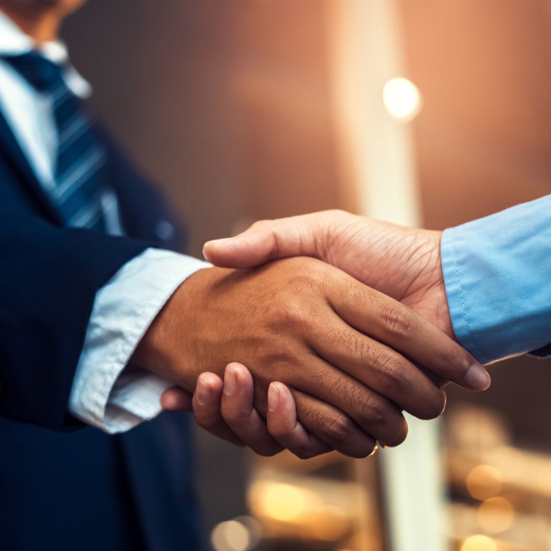 a lawyer shakes hands with a client