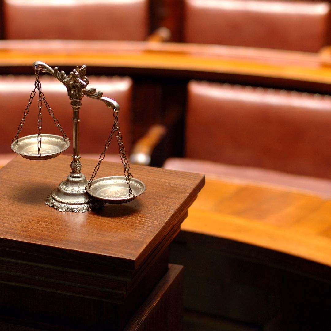 A courtroom with the scales of justice