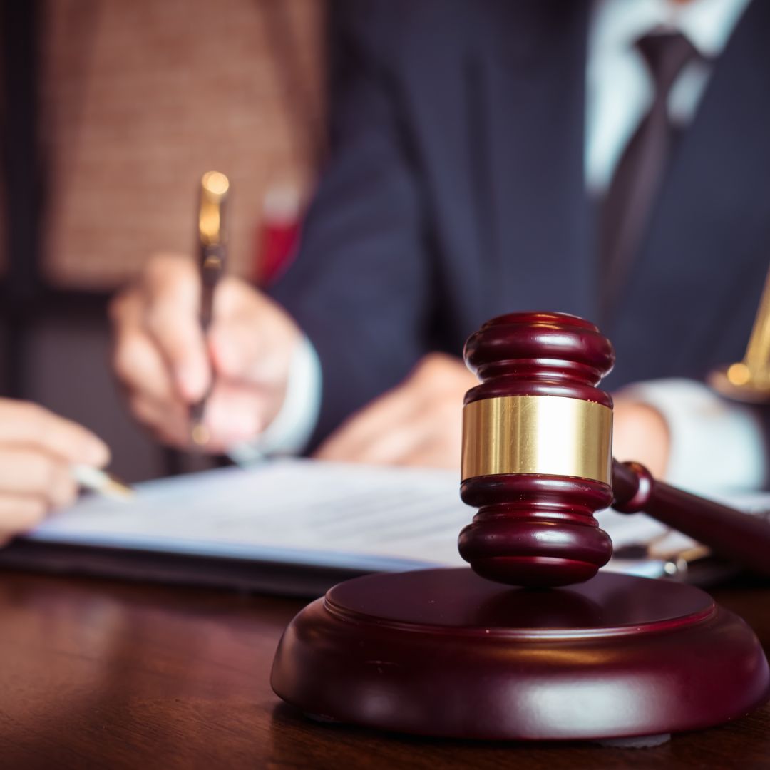 A lawyer working next to a gavel