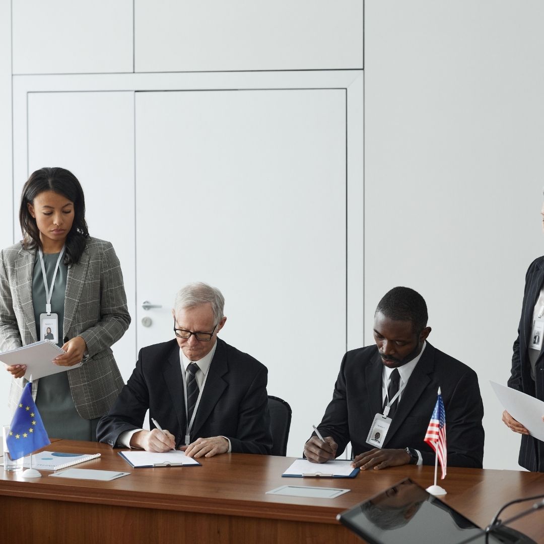 government officials signing documents