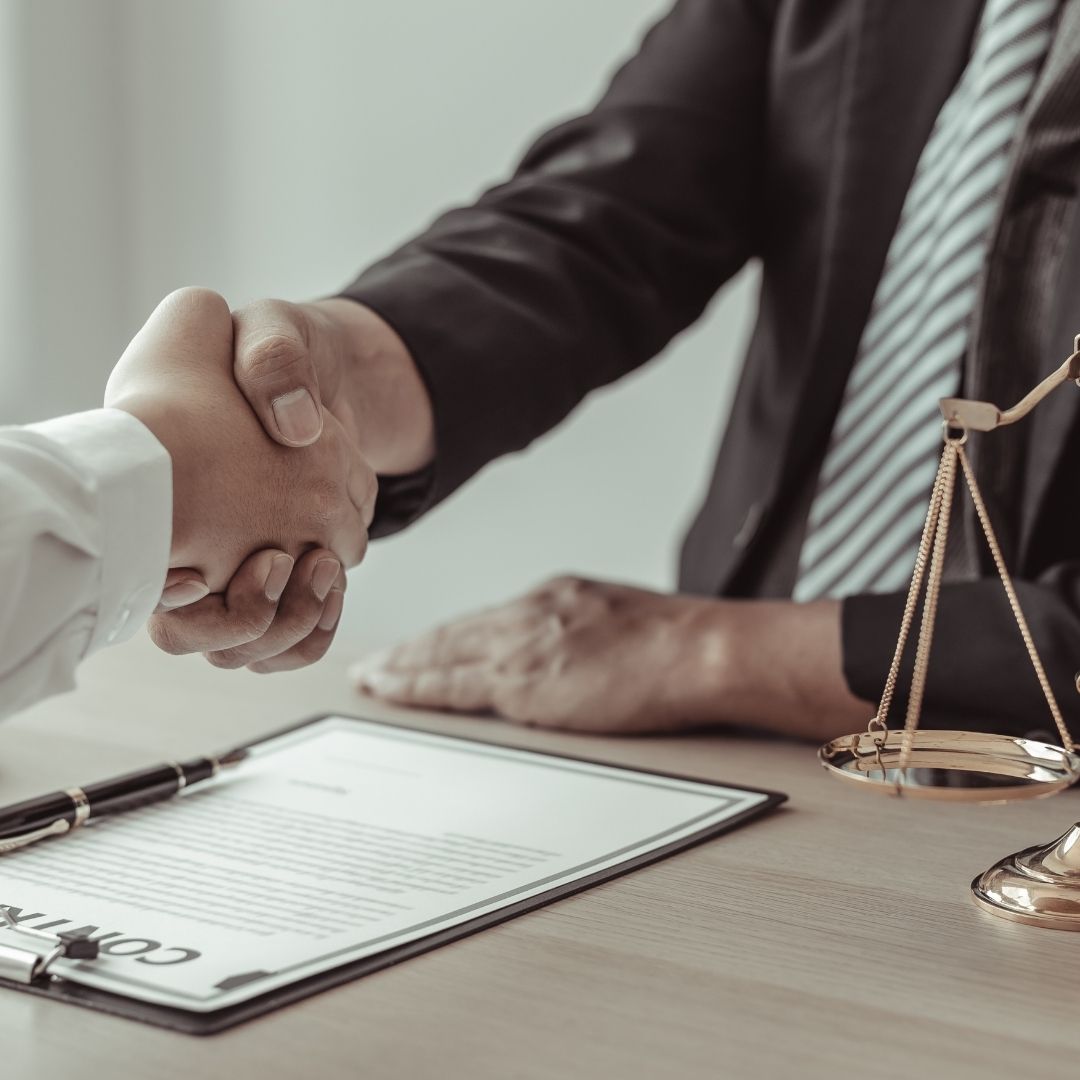 client and attorney shaking hands