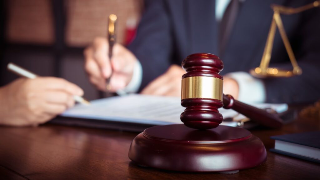 mass tort lawyer signing paperwork