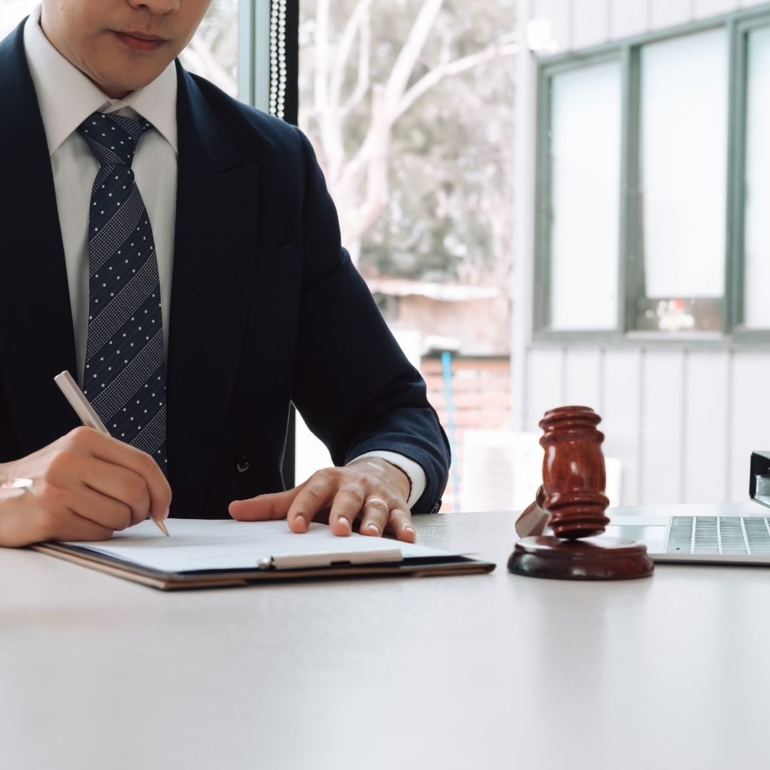 lawyer signing a document
