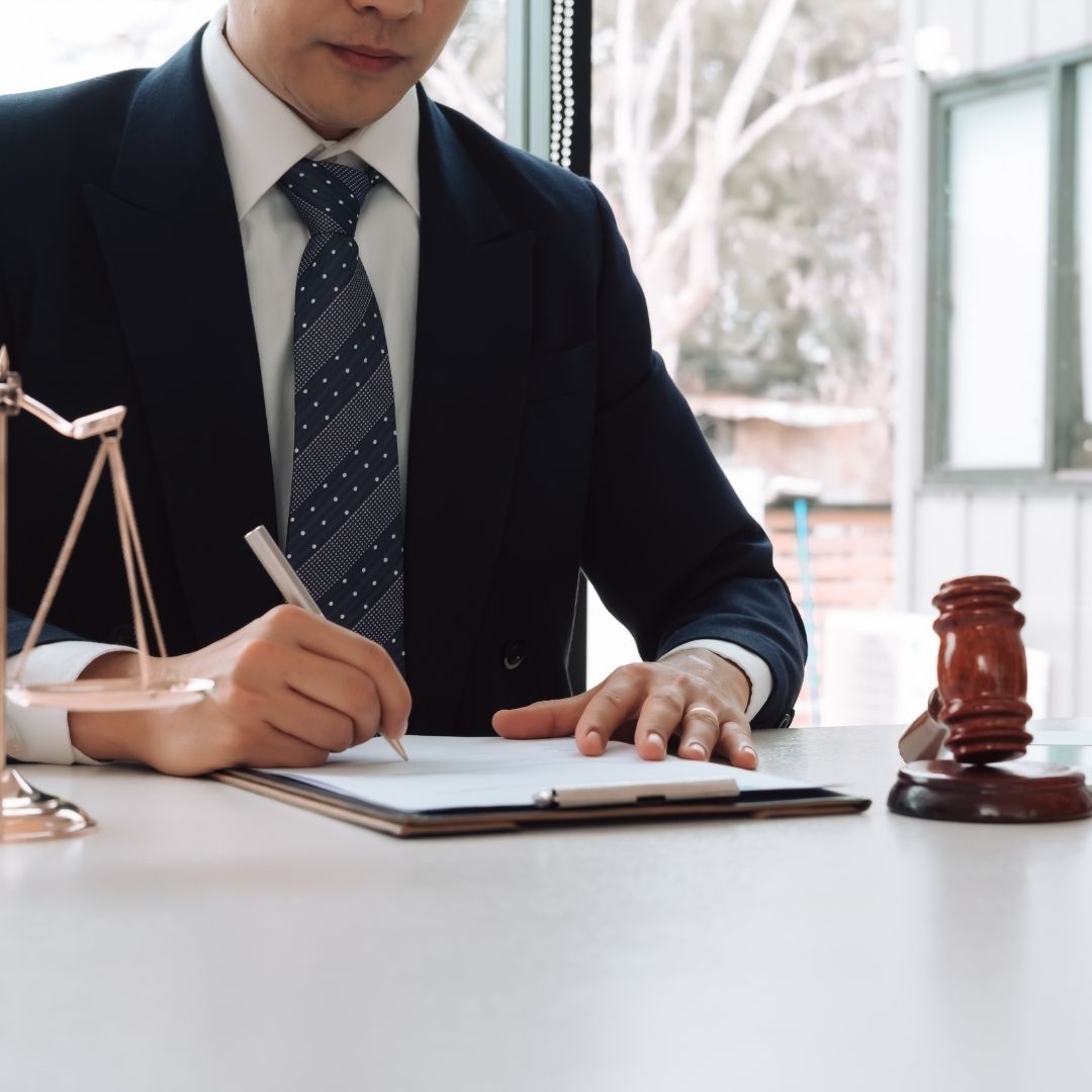 lawyer signing paperwork