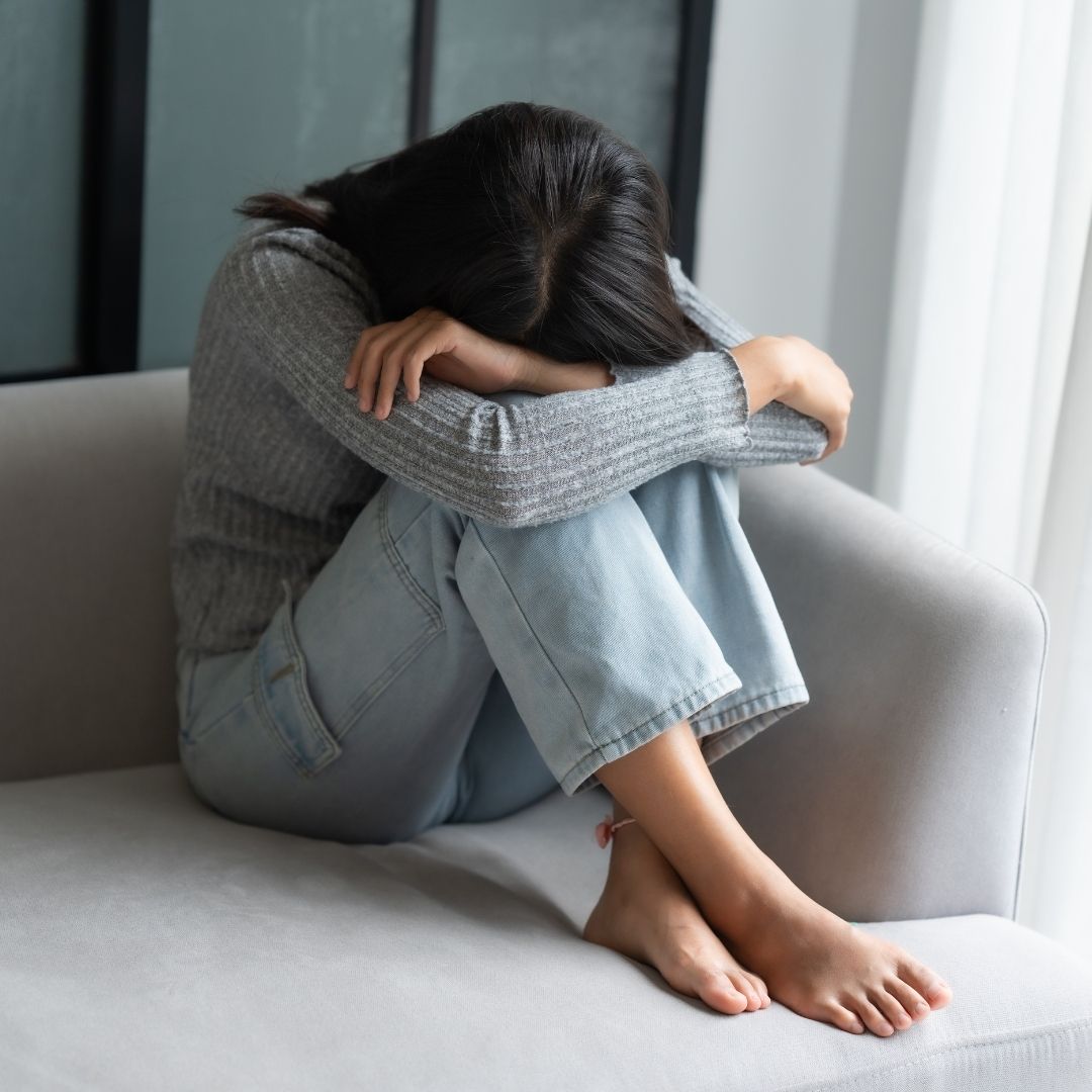 woman in distress on her couch