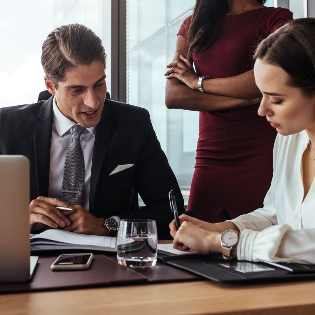lawyers gathered together working on a document