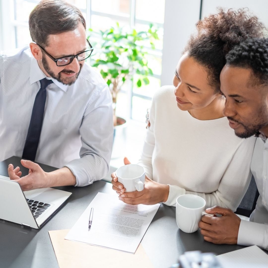 A couple speaking with their insurance agent